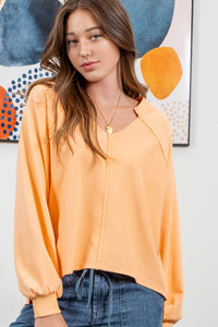 EXPOSED SEAM RELAXED LONG SLEEVE KNIT TOP